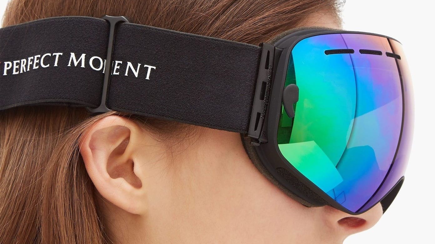 A set of ski goggles worn by a person