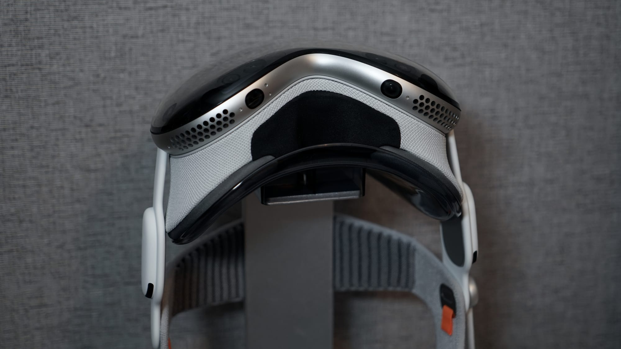 Apple Vision Pro with the Dual Knit band on a vertical stand