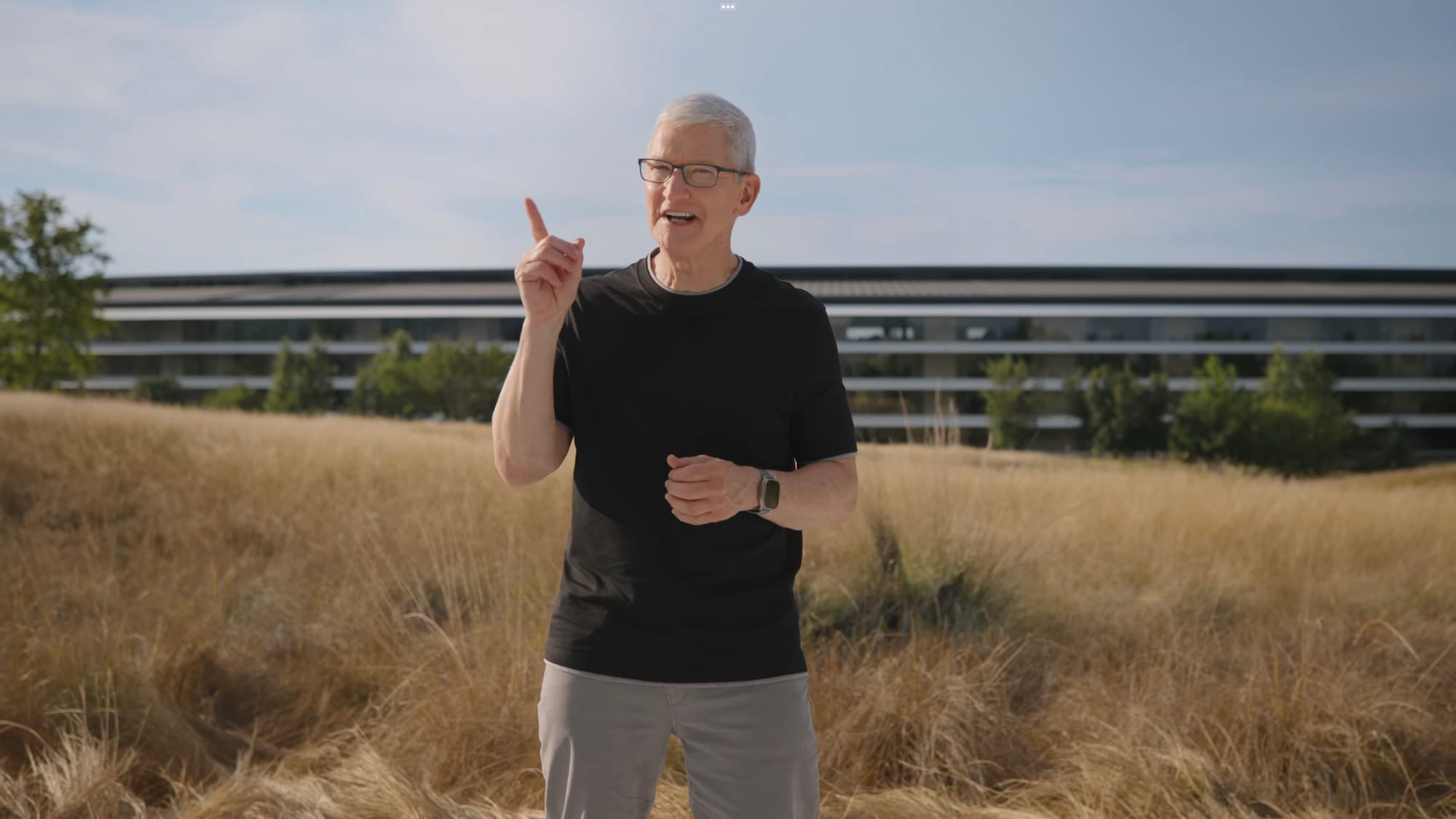 Tim Cook in a field outside of Apple Park