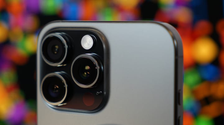 iPhone 16 Pro Max camera bump taken close with a rainbow colored backdrop