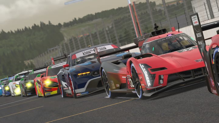 A starting grid of supercars on a racetrack rendered in a video game